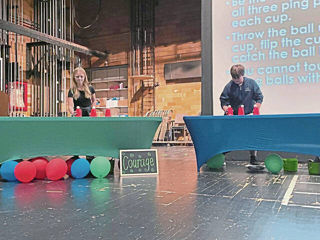 Greensburg Salem sixth grade students compete in a Minute to Win It game in December to earn points for their house. The students were sorted into one of four houses during orientation. The house system is meant to foster collaboration and school spirit among the class.
