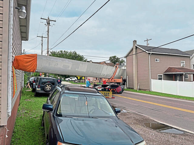 A wind turbine blade pierced the wall of Zeb’s Auto in Derry Township on July 8 when a truck hauling it was unable to make a sharp turn along Route 982 in Bradenville.